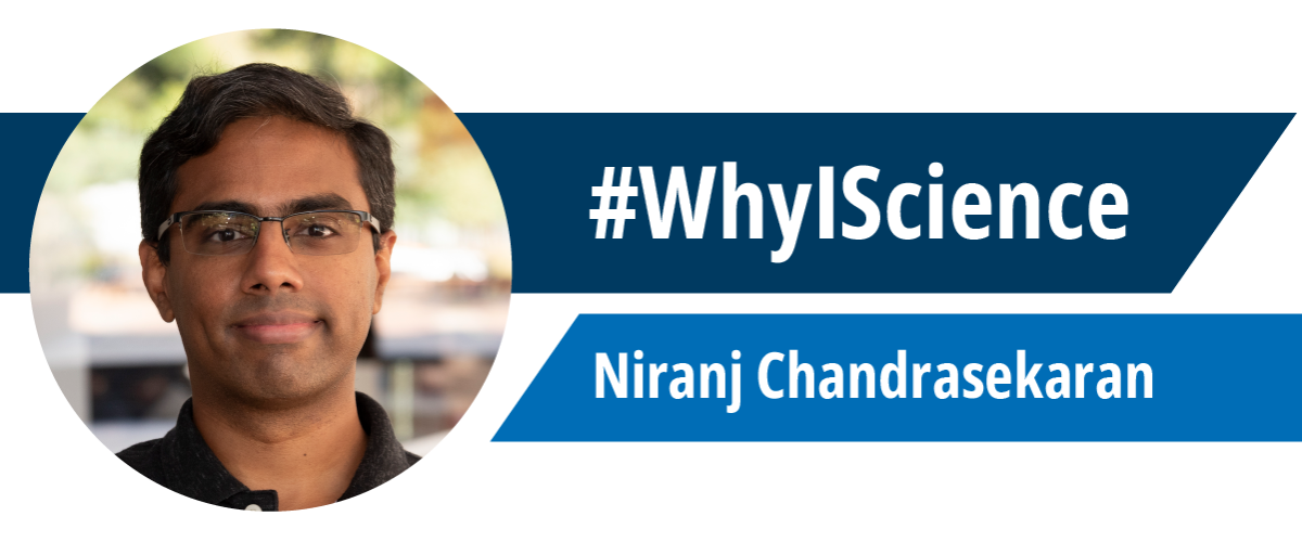 Portrait of Niranj Chandrasekaran next two two blue banners reading "#WhyIScience" and "Niranj Chandrasekaran"